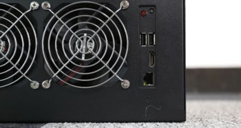 A detailed view of a high-performance mining rig in action, showcasing its cooling systems and robust build