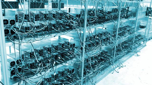 An array of mining rigs in a well-ventilated setup.